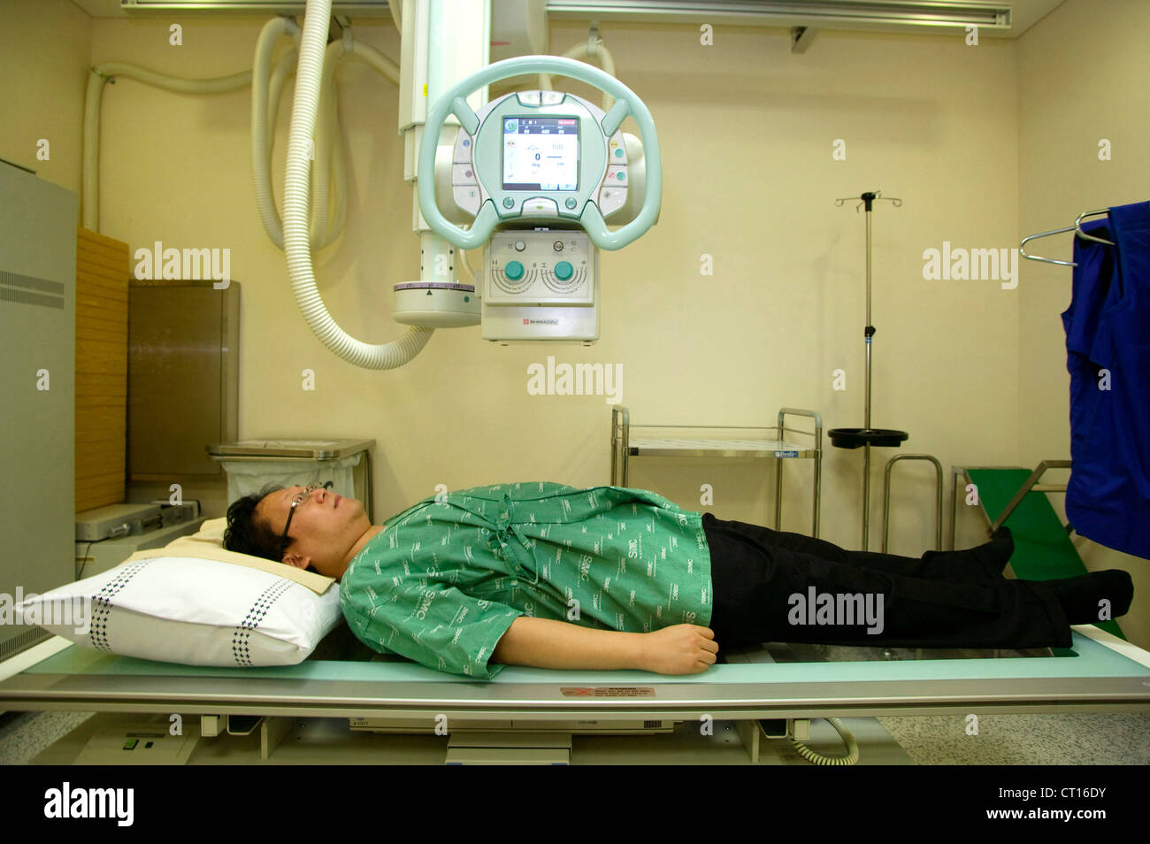 A patient is prepared for an x-ray machine. Stock Photo