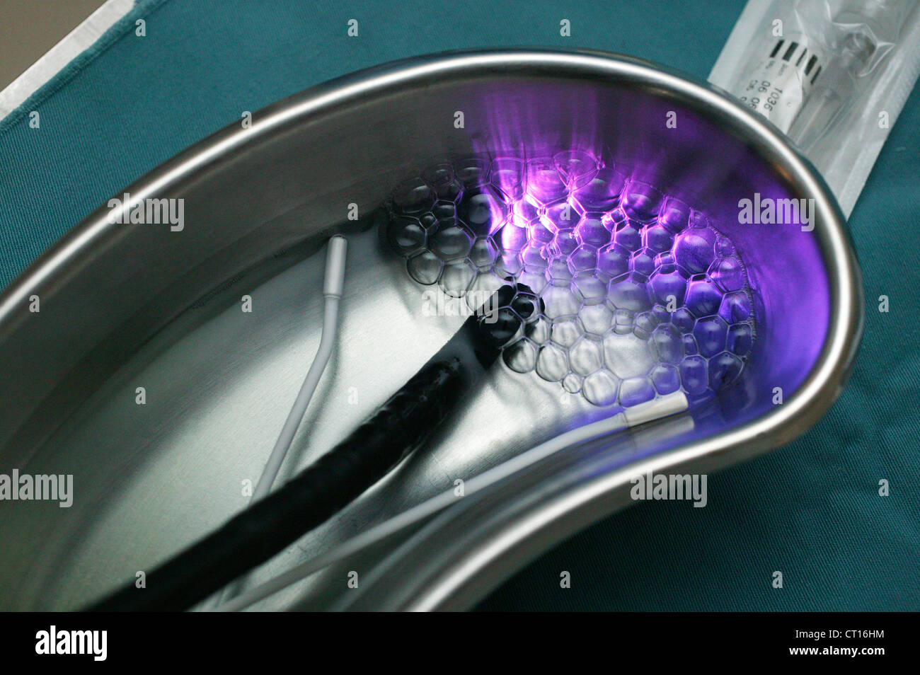 An endoscope is cleaned in a kidney dish following an endoscopic