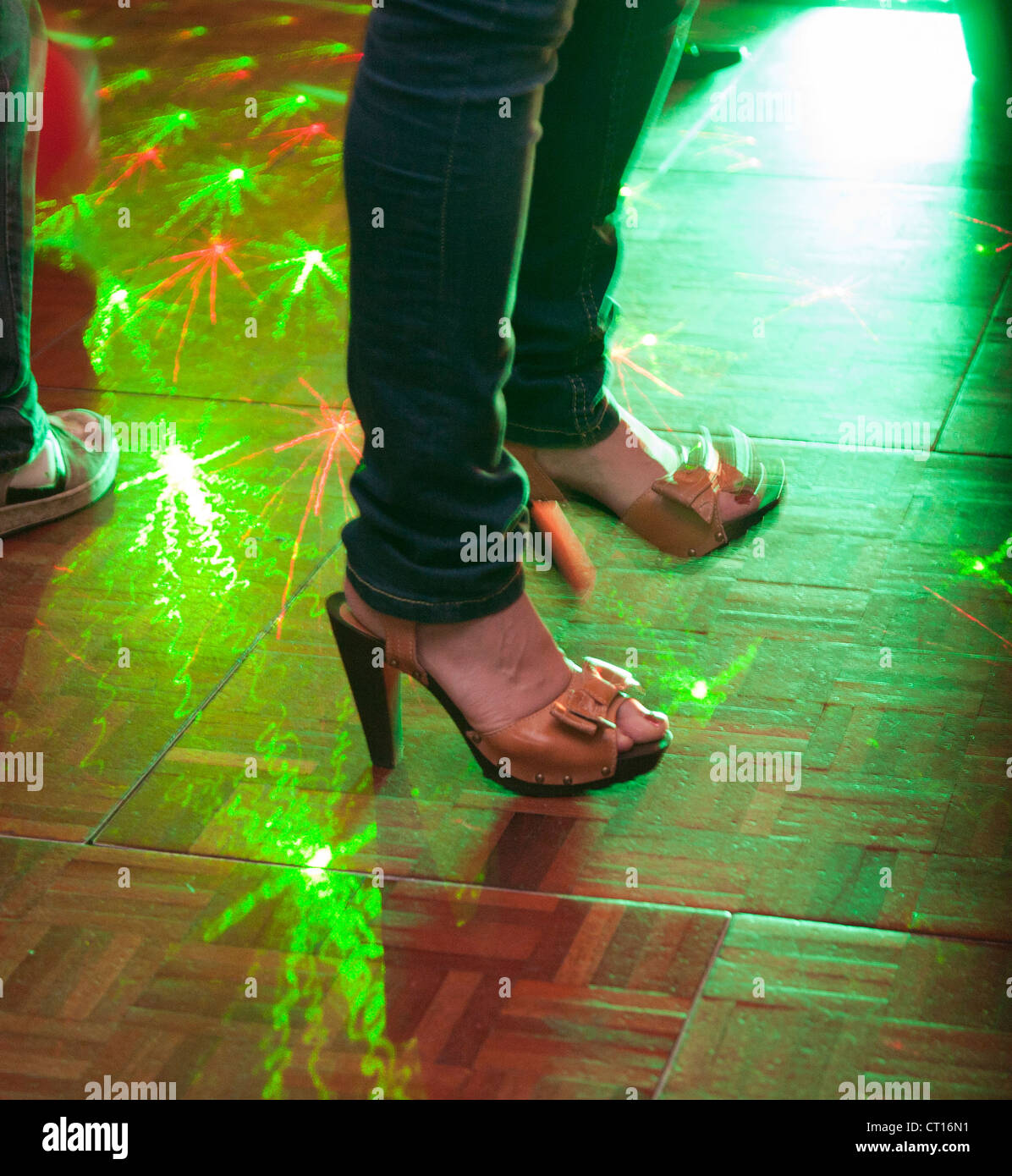 Someone dancing on a dance floor in a club Stock Photo