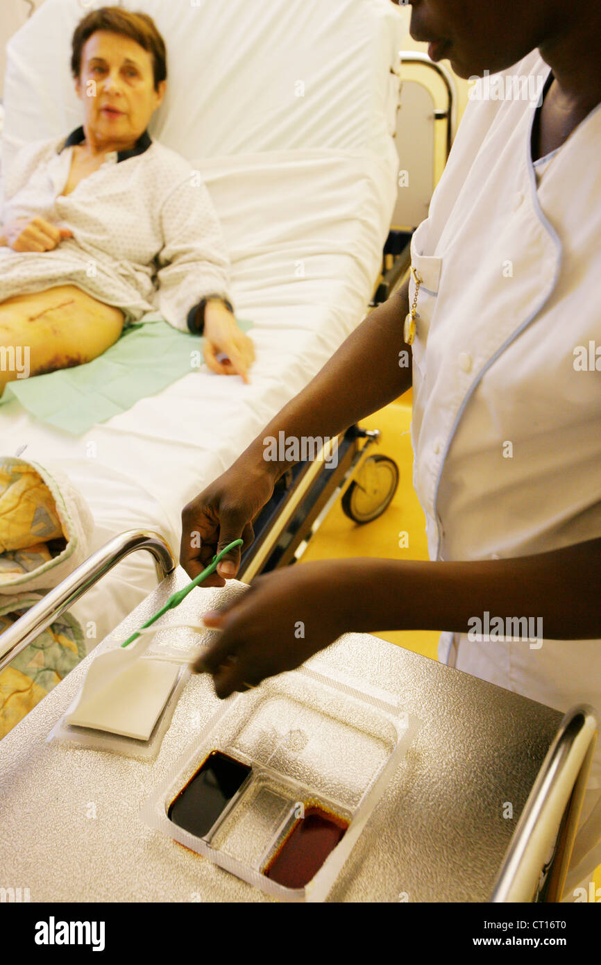 NURSE DISPENSING CARE Stock Photo - Alamy