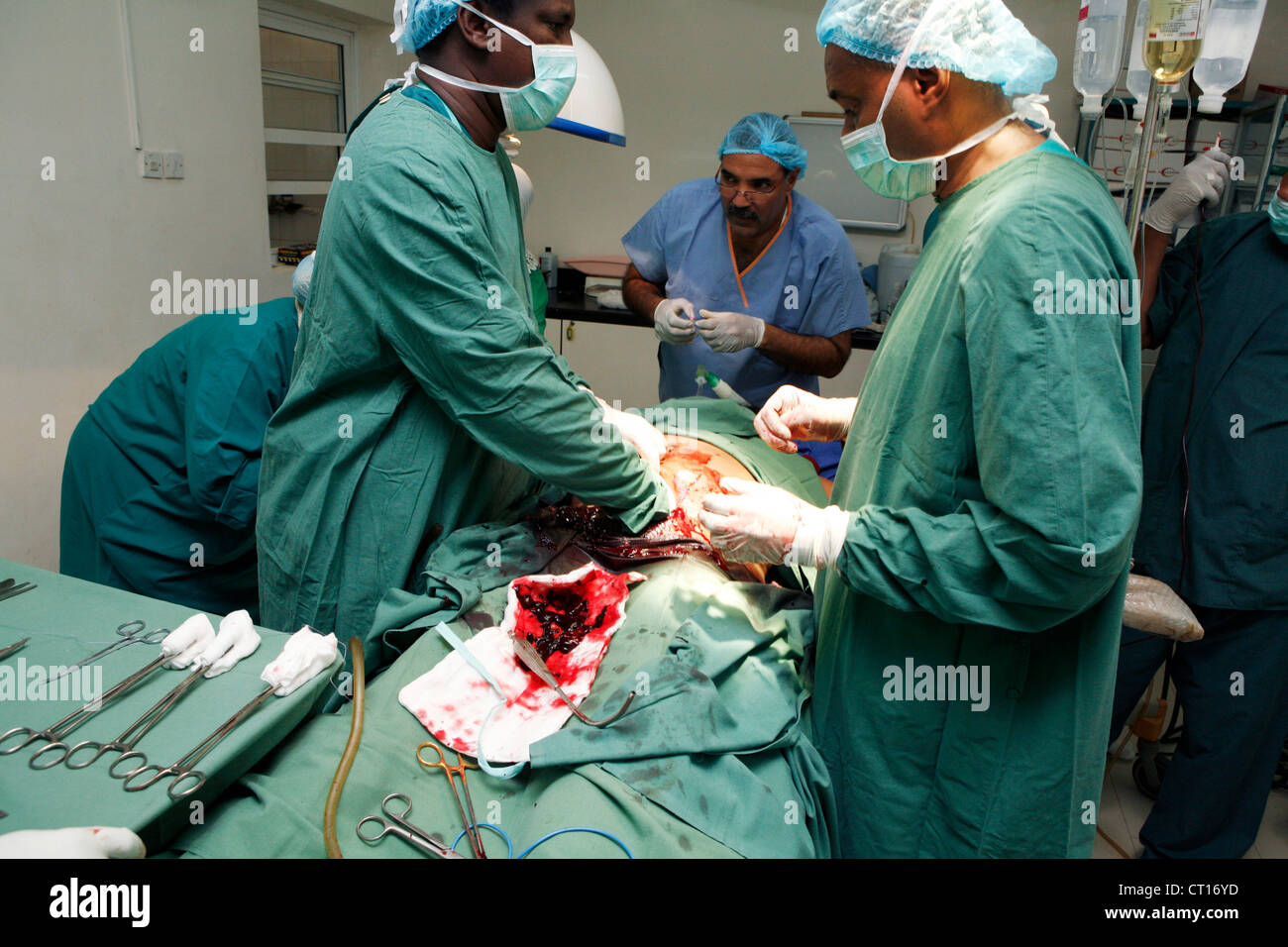 surgeons performing a cesarean section Stock Photo