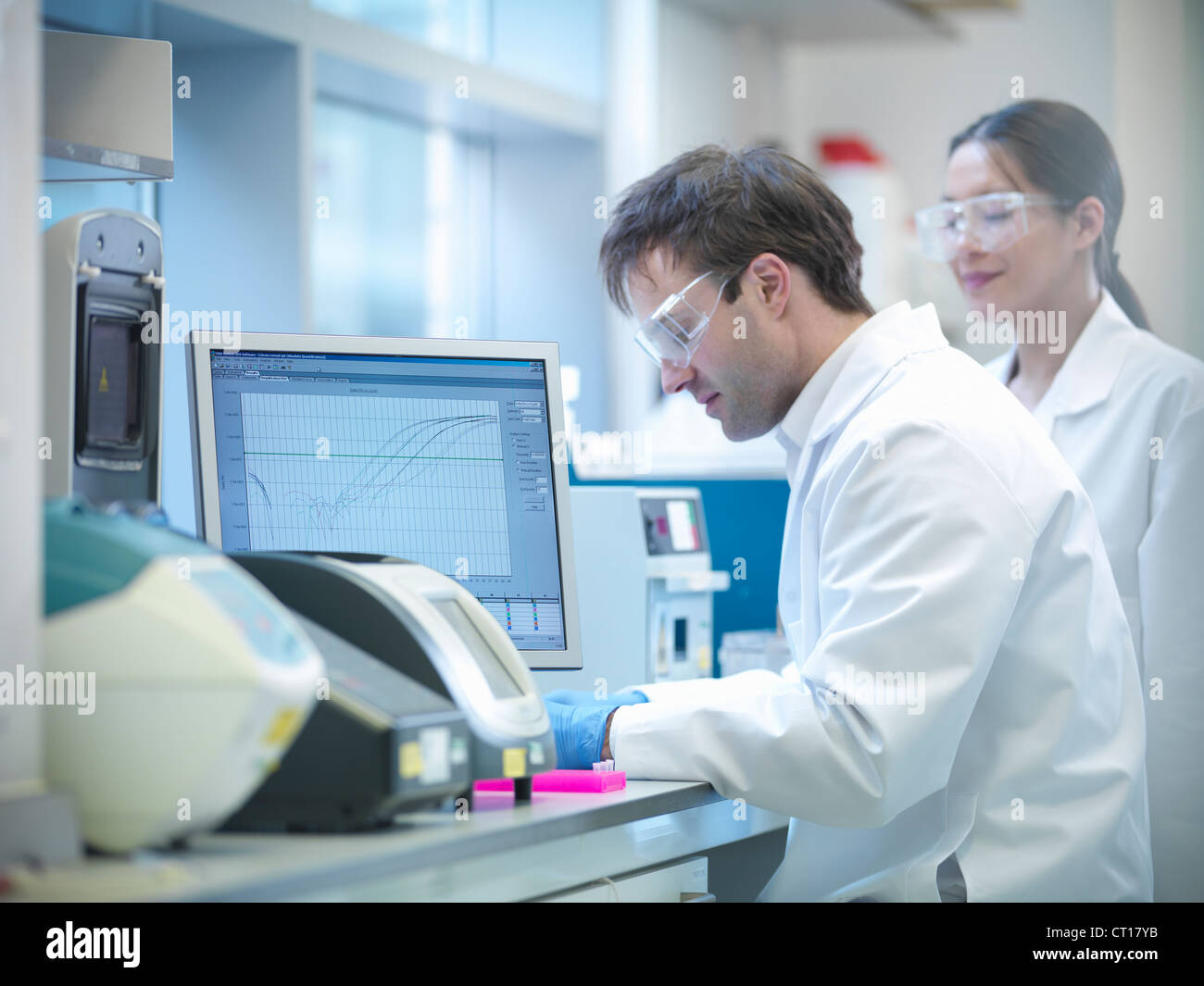 Scientist using computer in lab Stock Photo