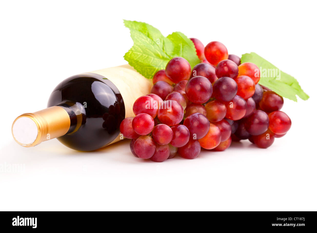 bottle of red wine and grapes, isolated on white background. Stock Photo