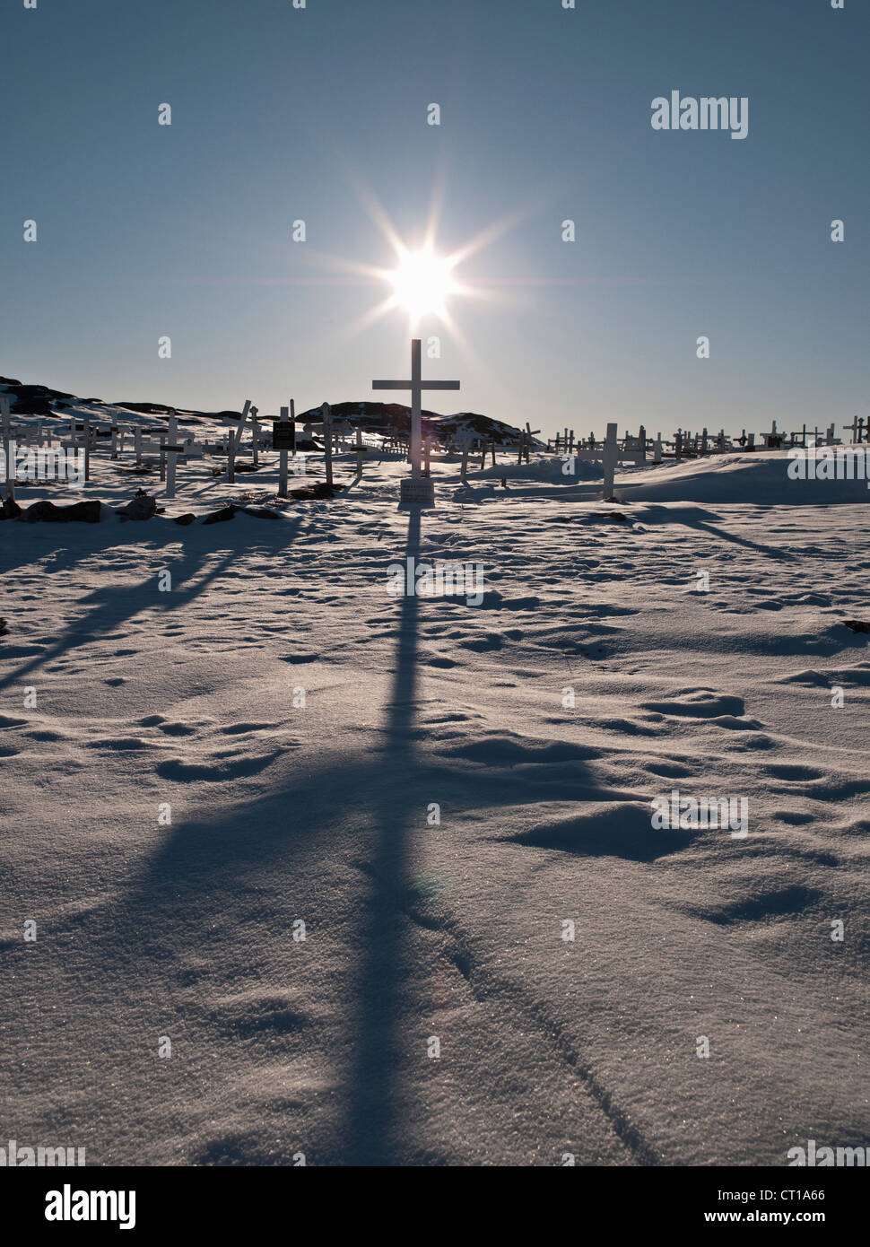 Crosses in graveyard casting shadows Stock Photo
