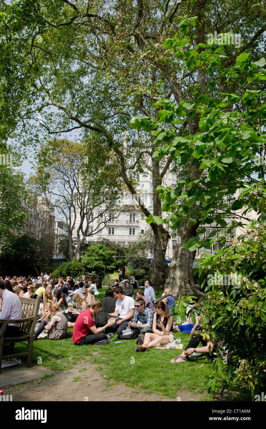 Londoners lunching in Golden Square, London Stock Photo