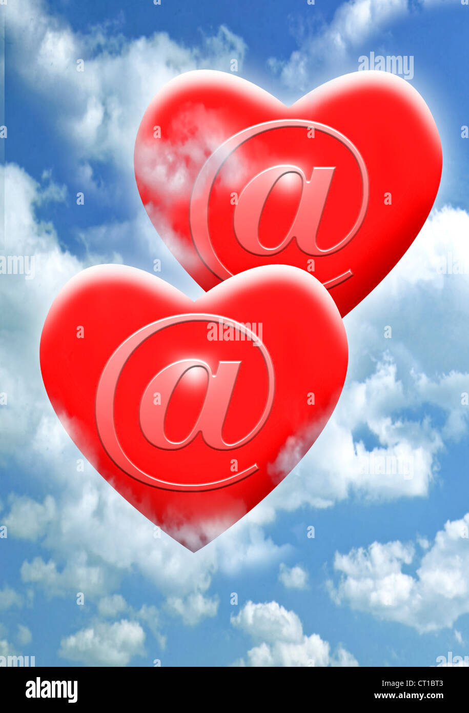 Two red hearts with @ sign on them - online dating Stock Photo
