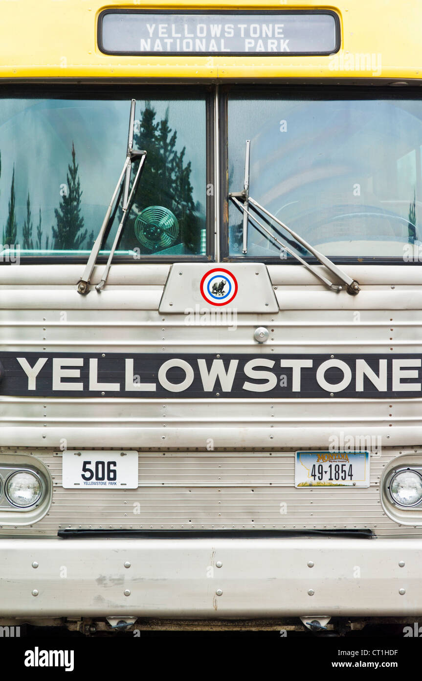 Yellow bus a Yellowstone National Park tour bus Yellowstone National Park Centre Yellowstone Wyoming USA United States of America Stock Photo