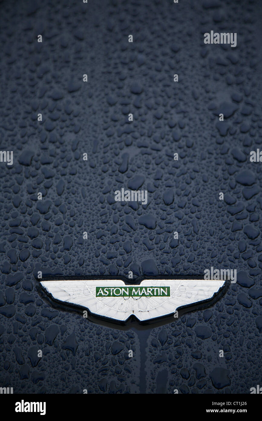 Crest on front of dark blue Aston Martin sportscar. Stock Photo