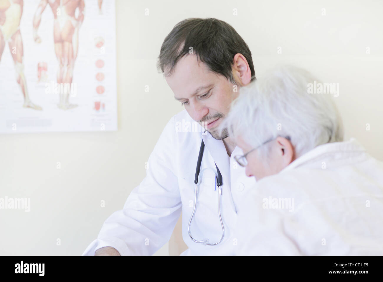 Doctor talking with patient in office Stock Photo