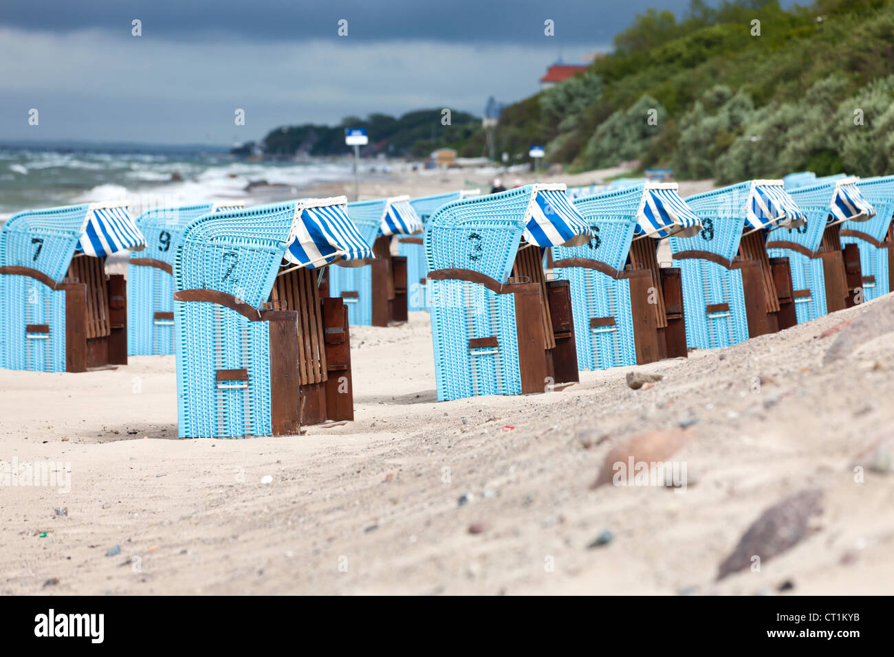 Many wicker beach chairs in a row on the german baltic sea beach Stock