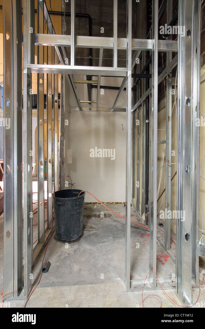 Metal Stud Framing in Commercial Retail Space Construction Site Stock Photo