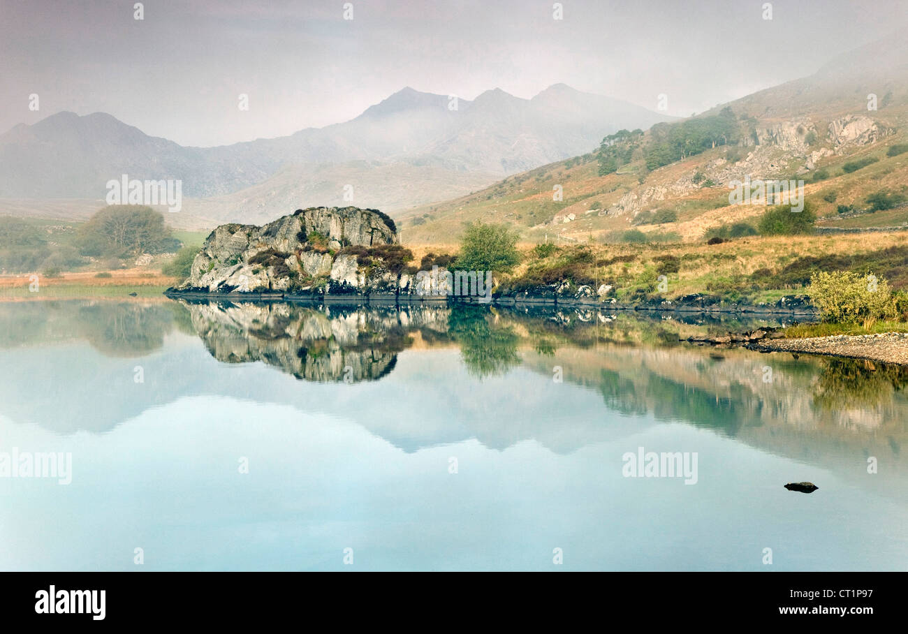 Morning mist on Llyn Mymbyr near Capel Curig Snowdonia mountain range National Park Gwynedd North Wales UK Stock Photo