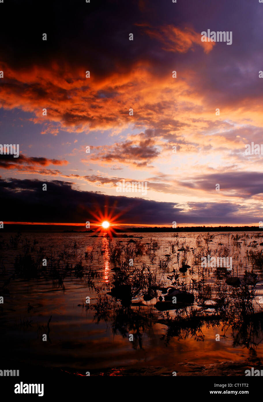 The Sun setting over Lake Huron near Tobermory, Ontario, Canada. Stock Photo