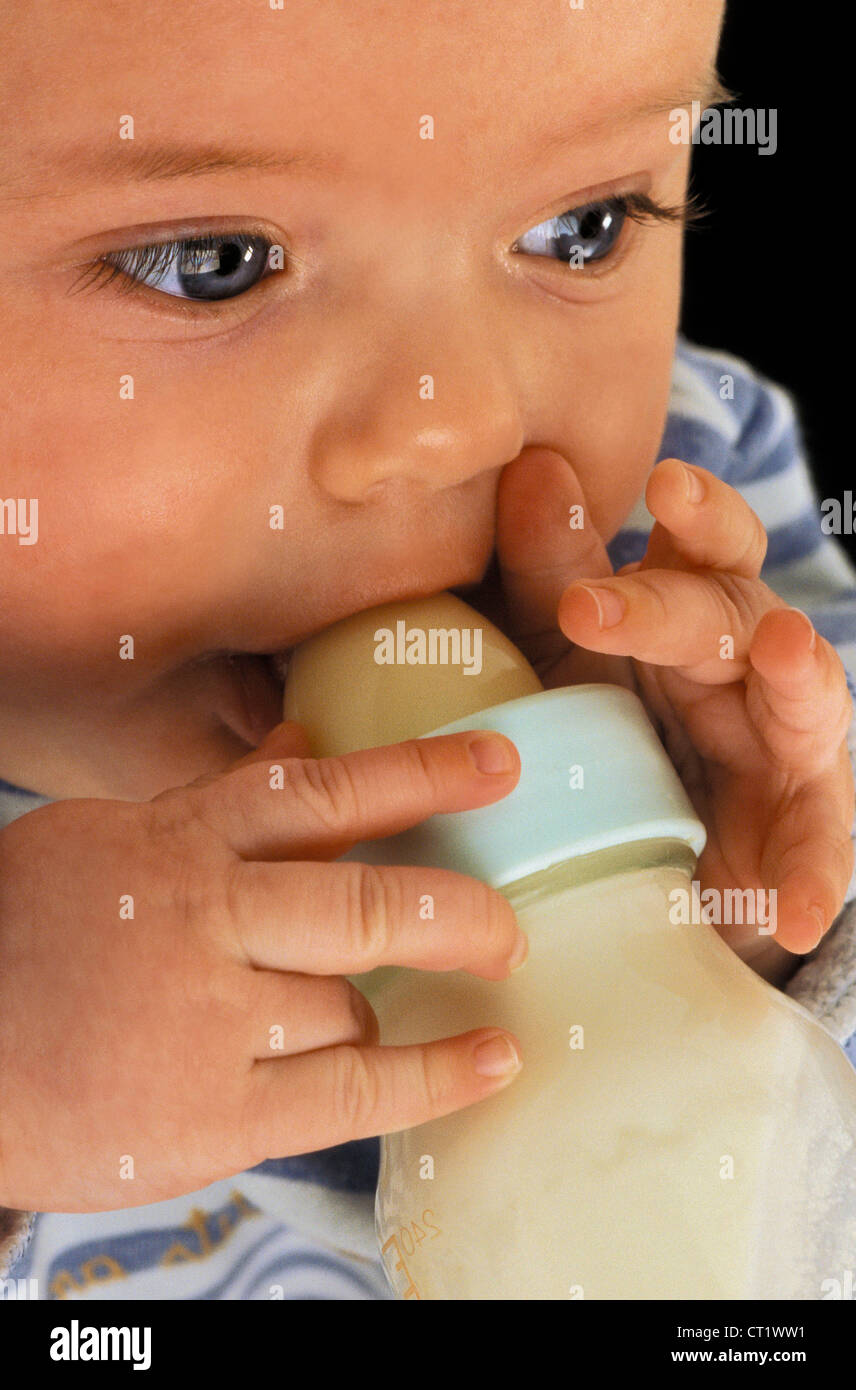 INFANT DRINKING FROM BABY BOTTLE Stock Photo Alamy