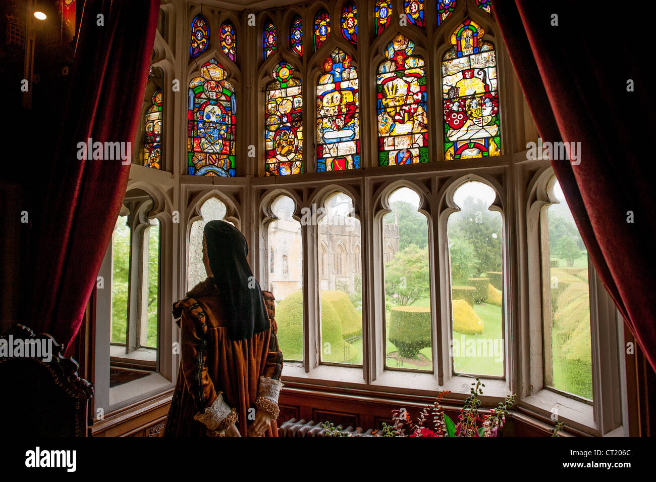 WINCHCOMBE, England — An exhibit at Sudeley Castle in Gloucestershire recreates the royal chambers of Catherine Parr, the sixth and final wife of King Henry VIII. The thoughtfully designed display features period furnishings and stained glass windows that overlook the castle's historic chapel. Sudeley Castle, dating from the 15th century, served as Catherine Parr's home during her final years following Henry VIII's death in 1547. She lived at the estate with her fourth husband, Thomas Seymour, until her death in 1548 shortly after childbirth. The castle remains one of England's most significan Stock Photo