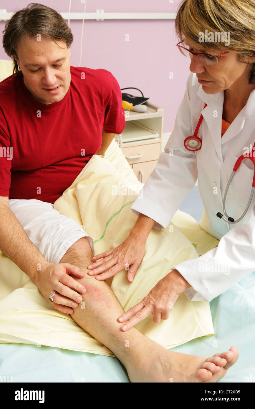 Doctor patient hospital gown hi-res stock photography and images - Alamy