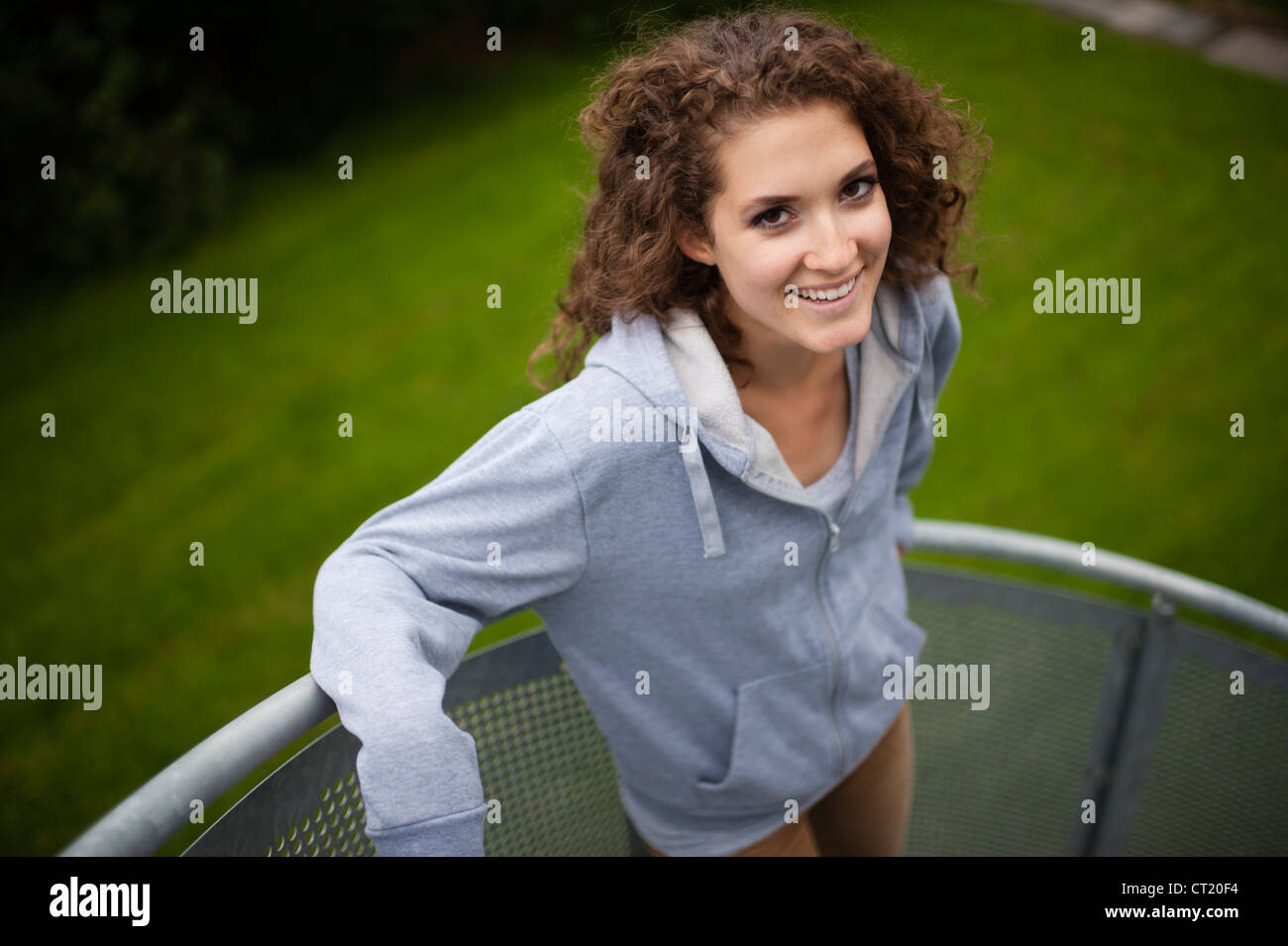 A young 20 year old slim attractive smiling happy woman girl uk stock