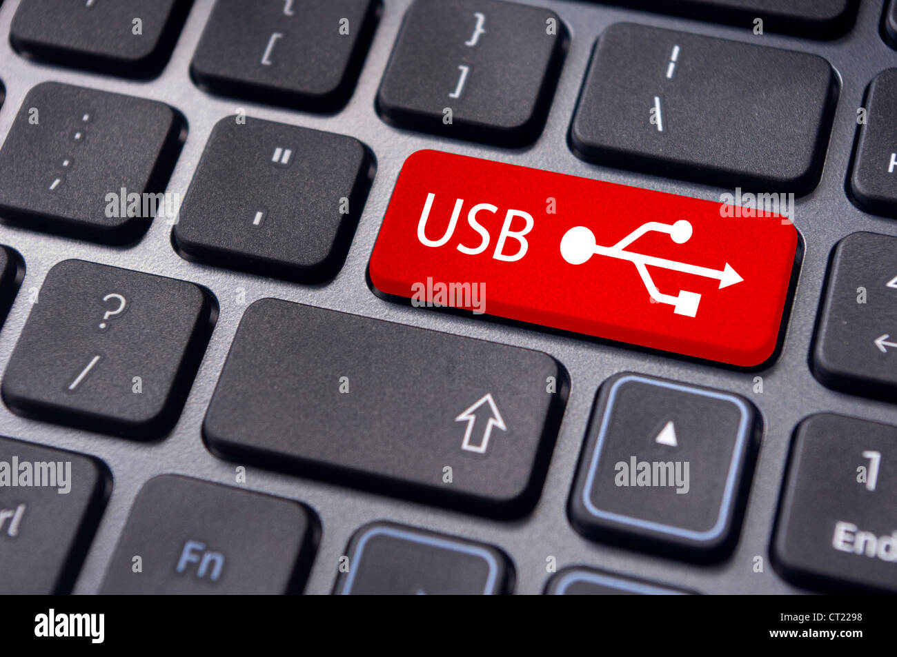USB signs on enter key of keyboard, for concepts of USB ready devices. Stock Photo