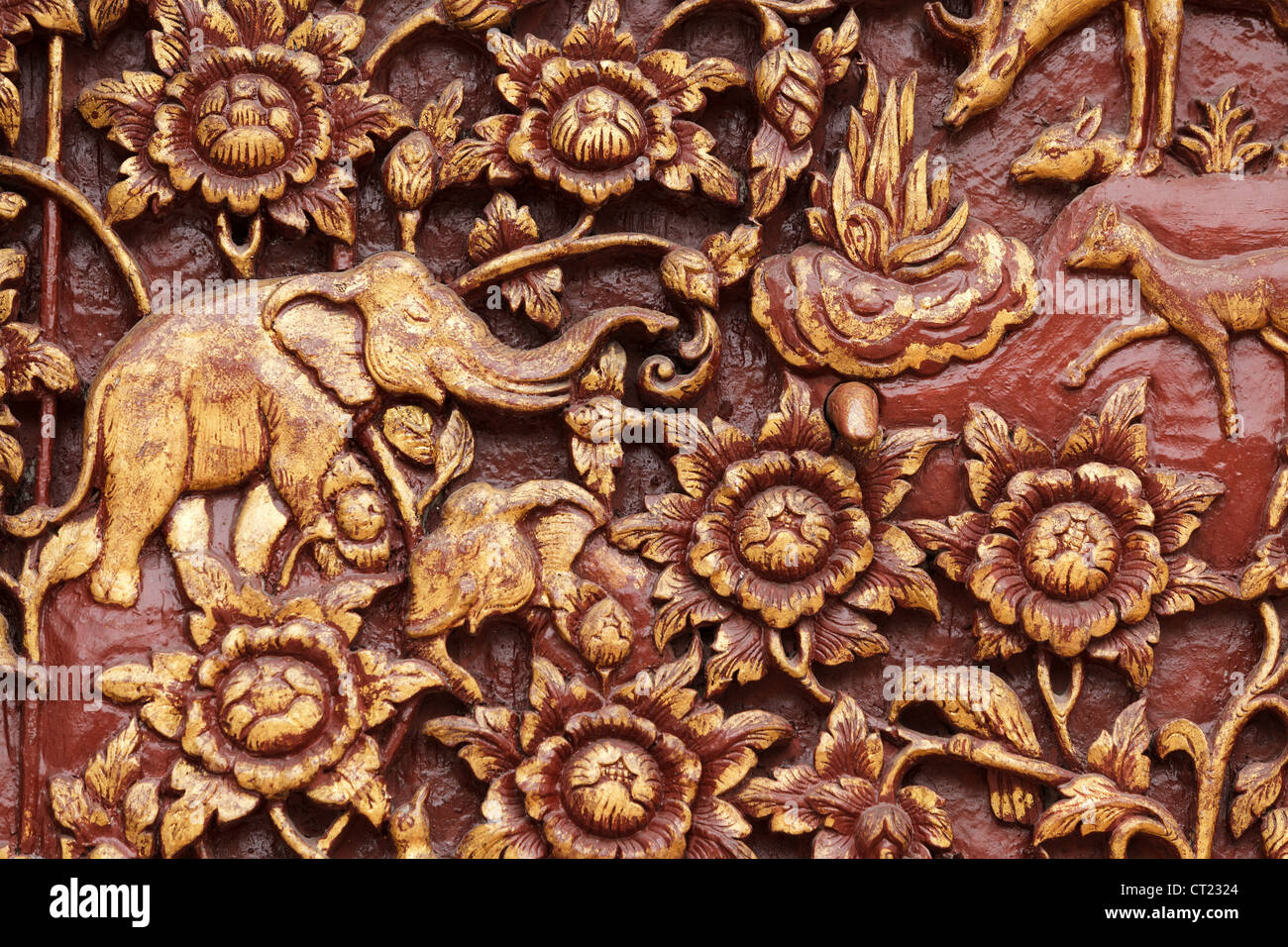 religious wooden carving detail of buddhist temple door, Thailand Stock Photo