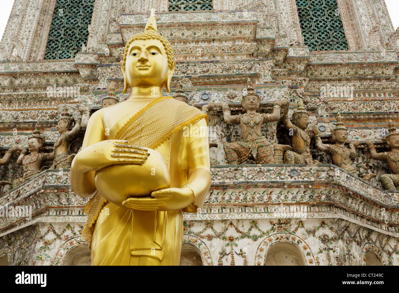 golden buddha statue holding bowl, wat arun temple, Bangkok, Thailand Stock Photo