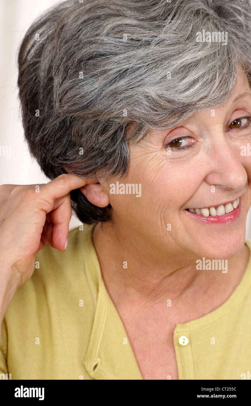 Woman hands ears elderly hi-res stock photography and images - Alamy