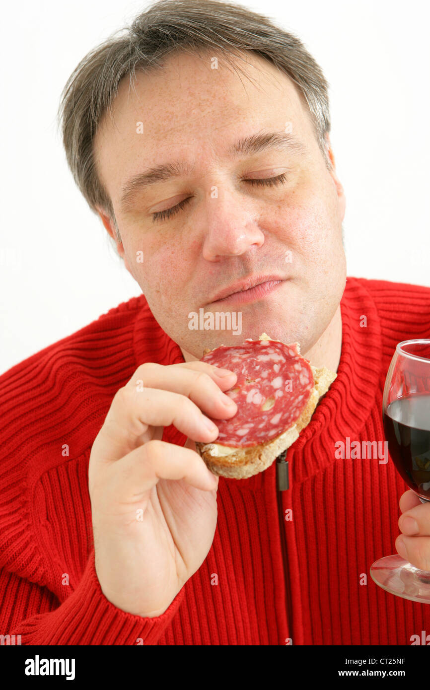 MAN EATING PORK MEAT Stock Photo Alamy