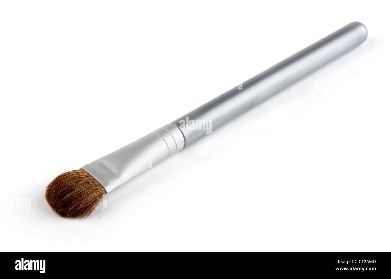 Small silver makeup brush isolated on white Stock Photo