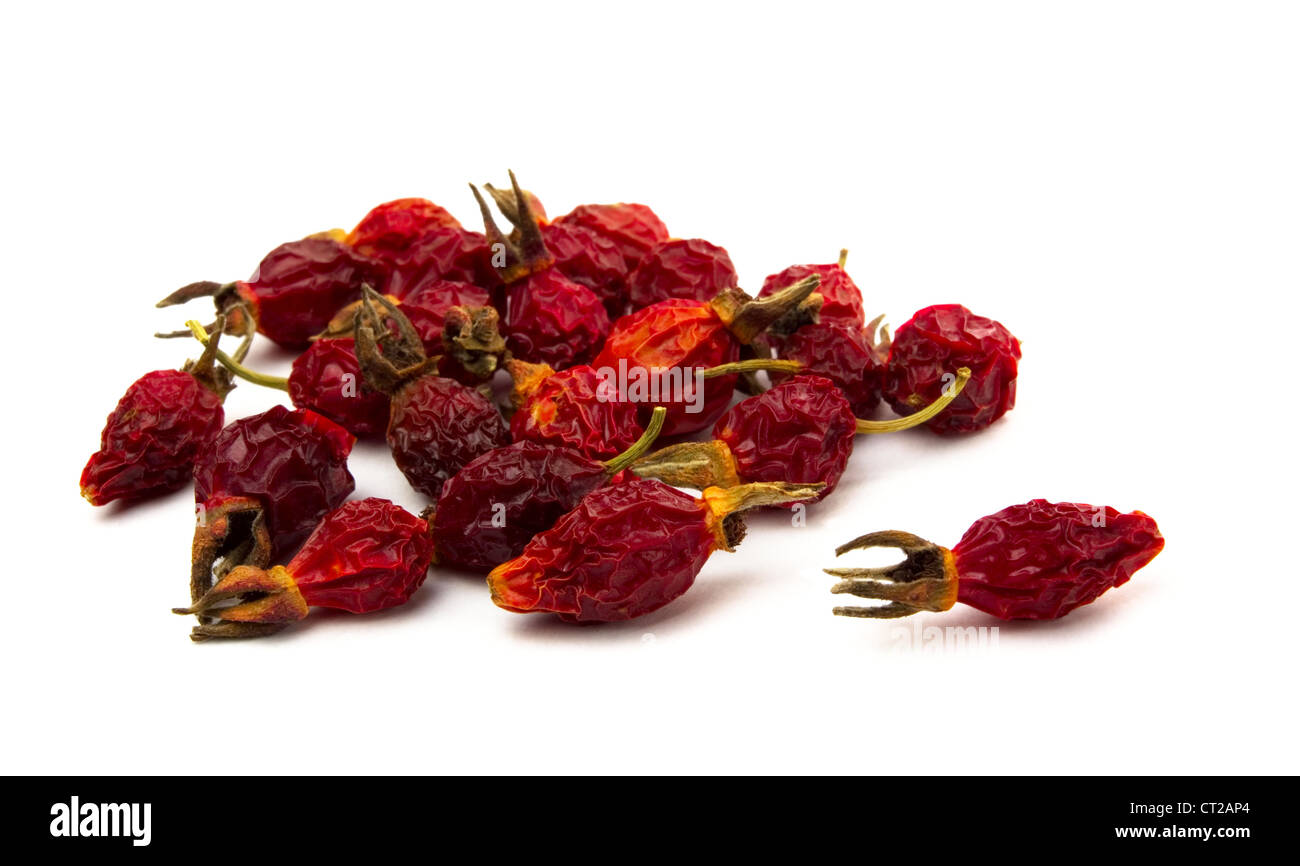Pile of dried rose hips isolated on white Stock Photo