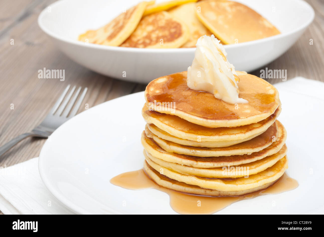 Homemade Pancakes With Butter and Warm Maple Syrup Stock Photo