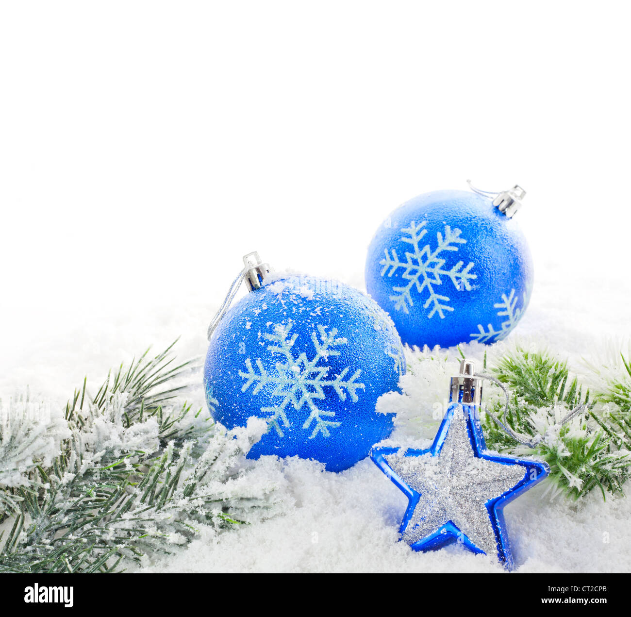 New year theme: Christmas tree white and silver decorations, blue balls,  snow, snowflakes, serpentine on white retro stylized wood background  contrasted Stock Photo by ©BoxerX 90908586