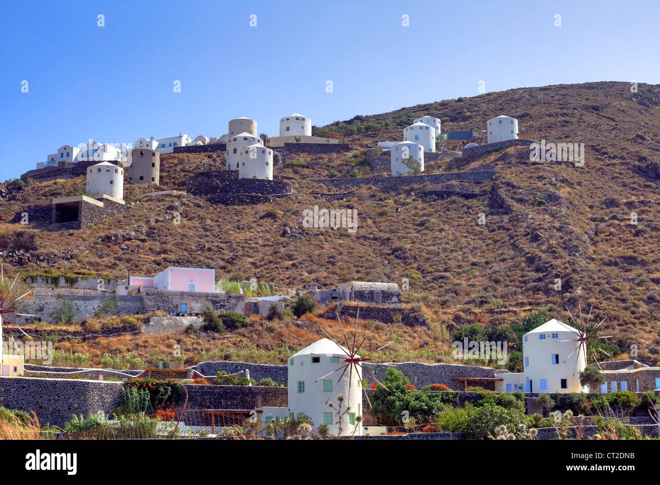 Construction of a holiday complex in the style of wind mills in the south of Santorini, Greece Stock Photo