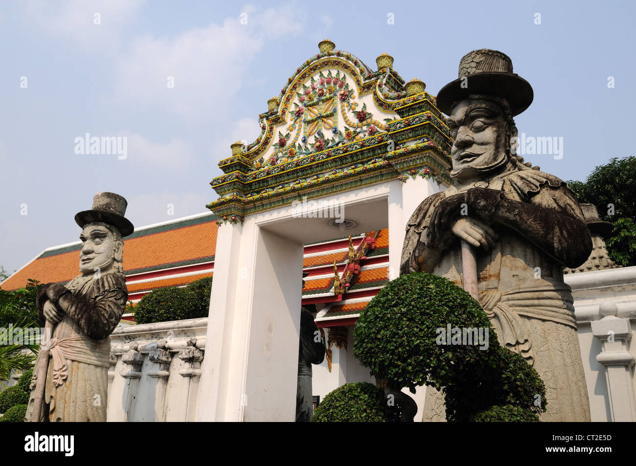 Guardian statues at Wat Po Buddhist Temple Bangkok Thailand Stock Photo