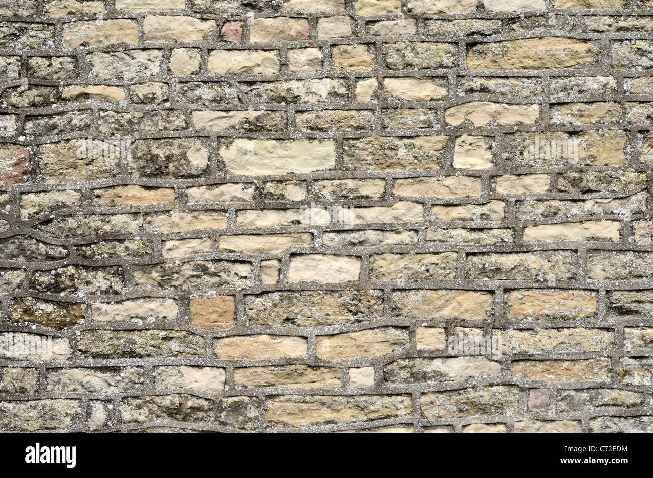 Stone building wall / detail of weathered sandstone - Cotswolds. Visual allegory for 'firewall' or file 'access denied', solid stone wall. Stock Photo