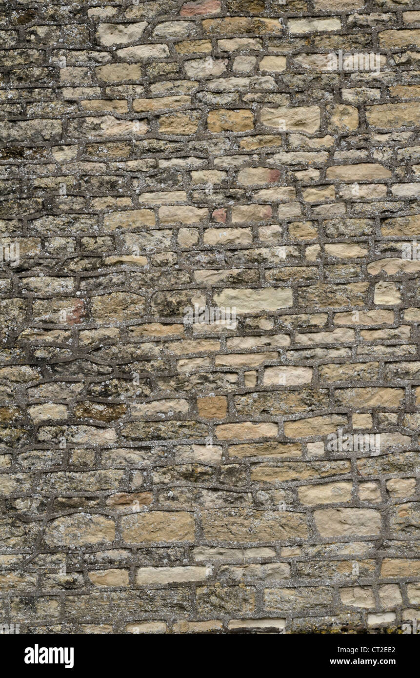 Stone building, gable end wall / detail of weathered sandstone - Cotswolds. Visual allegory for 'firewall' or file access denied. Solid stone wall. Stock Photo