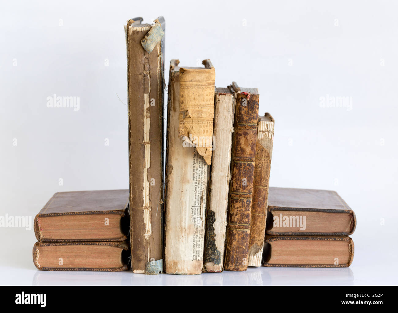 Volumes of old books with damaged covers Stock Photo