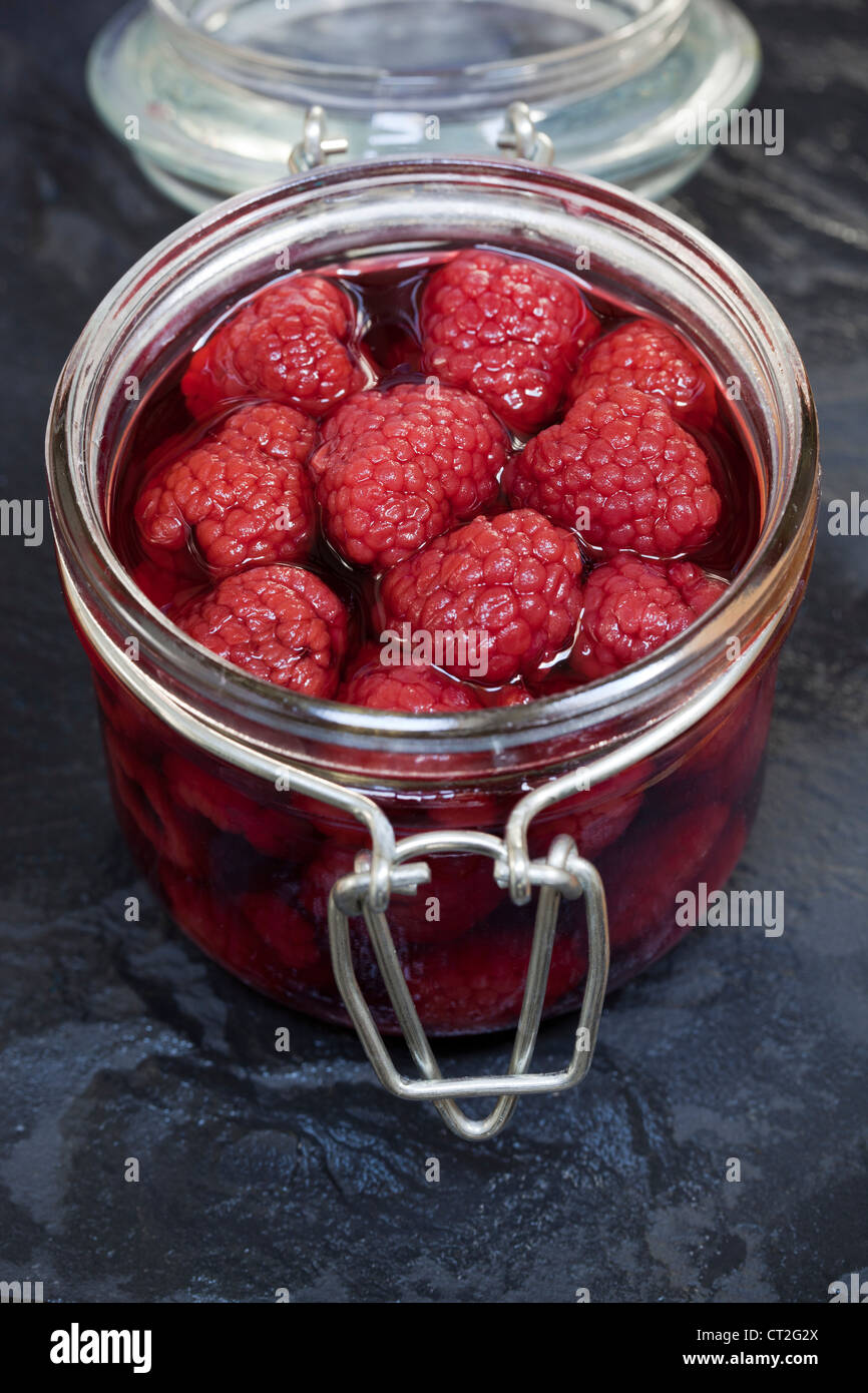 Raspberries in Glass Storage Jar Stock Photo Alamy