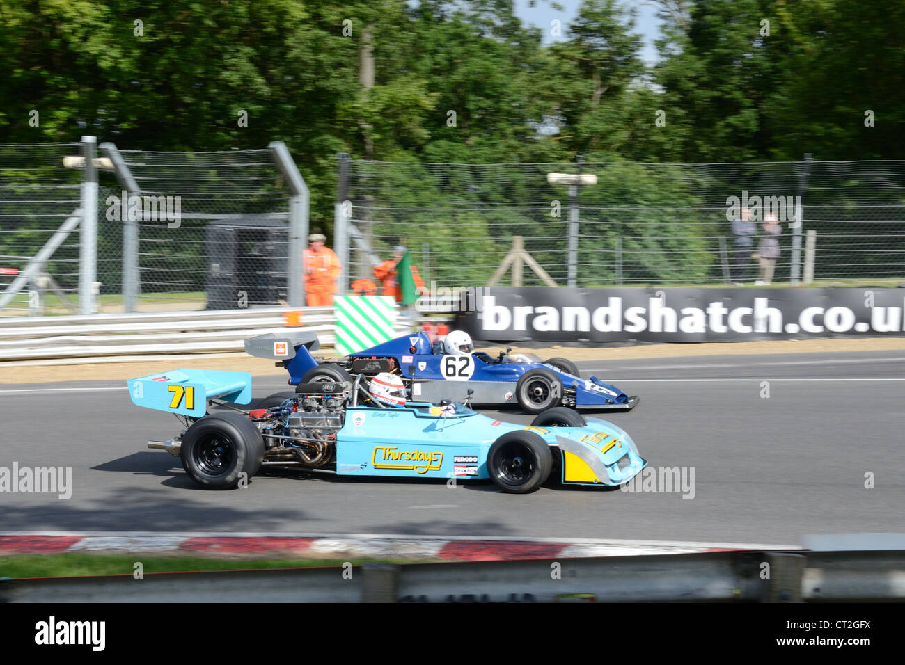 two classic cars racing at brands hatch Stock Photo Alamy