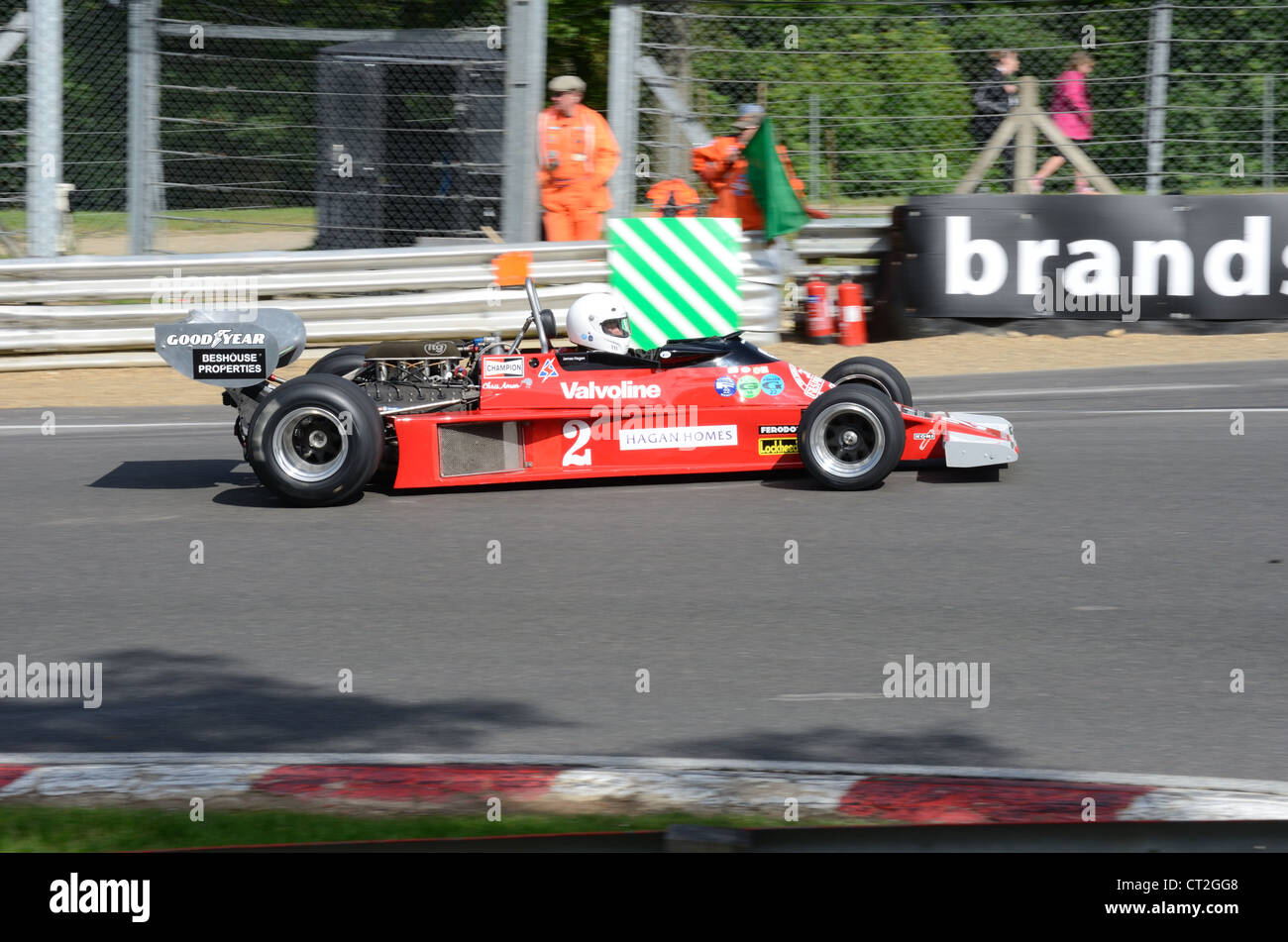 red racing car on track Stock Photo - Alamy