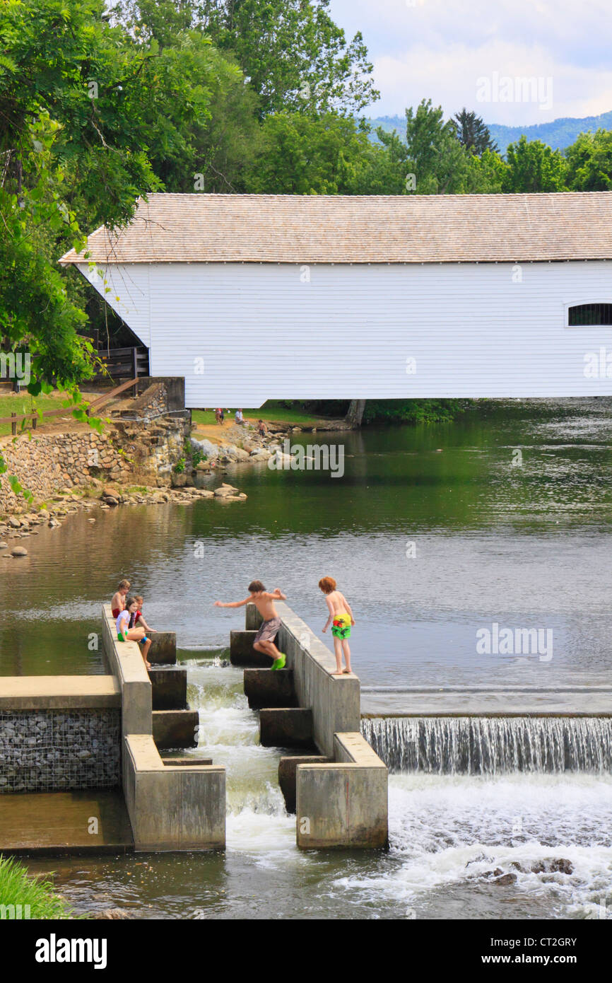 PLAYING IN THE FISH LADDER, DOE RIVER COVERED BRIDGE, ELIZABETHTON, TENNESSEE, USA Stock Photo