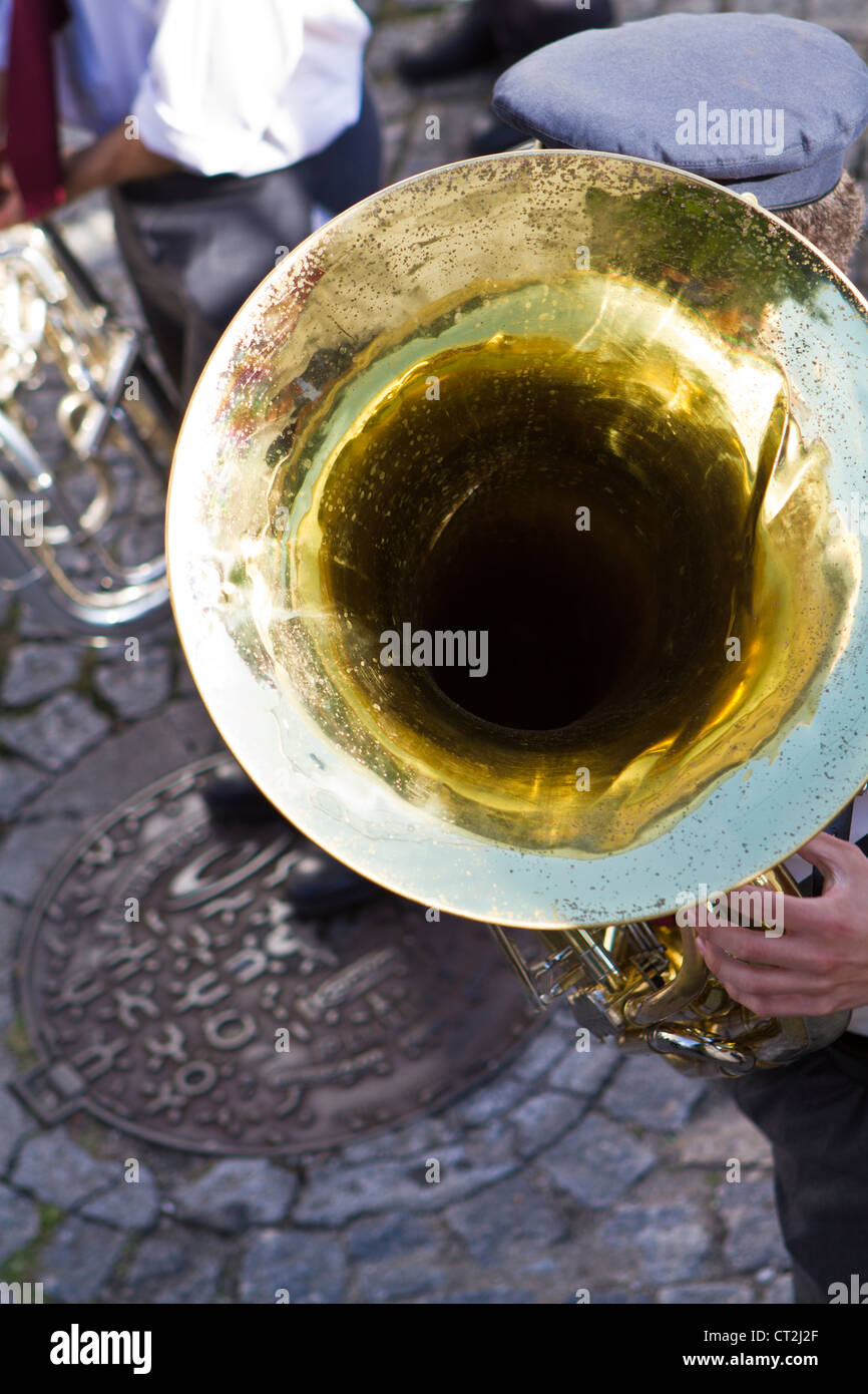 Man playing tuba outdoors Stock Photo