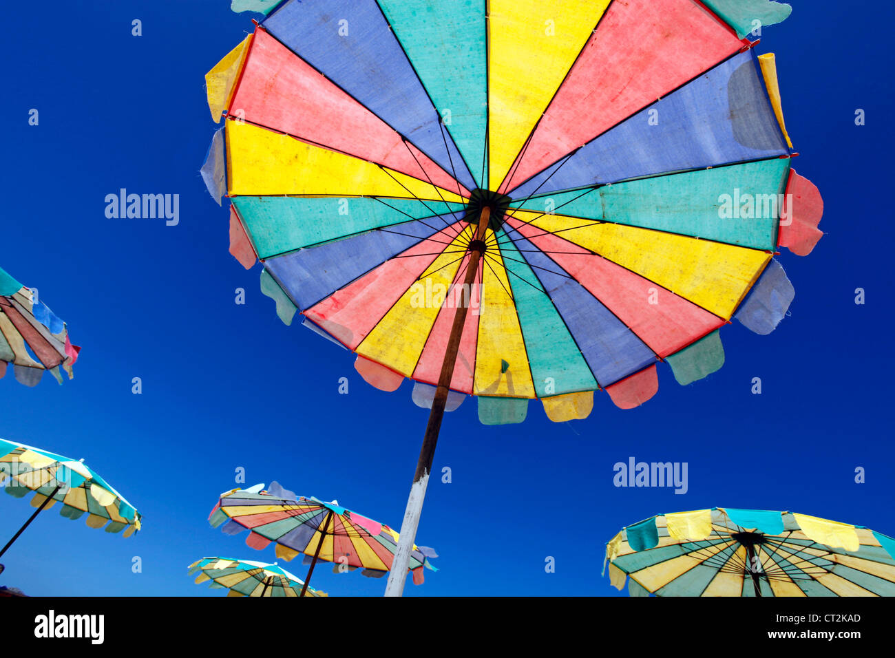 Colourful beach umbrellas for a summer holiday on the tropical sandy