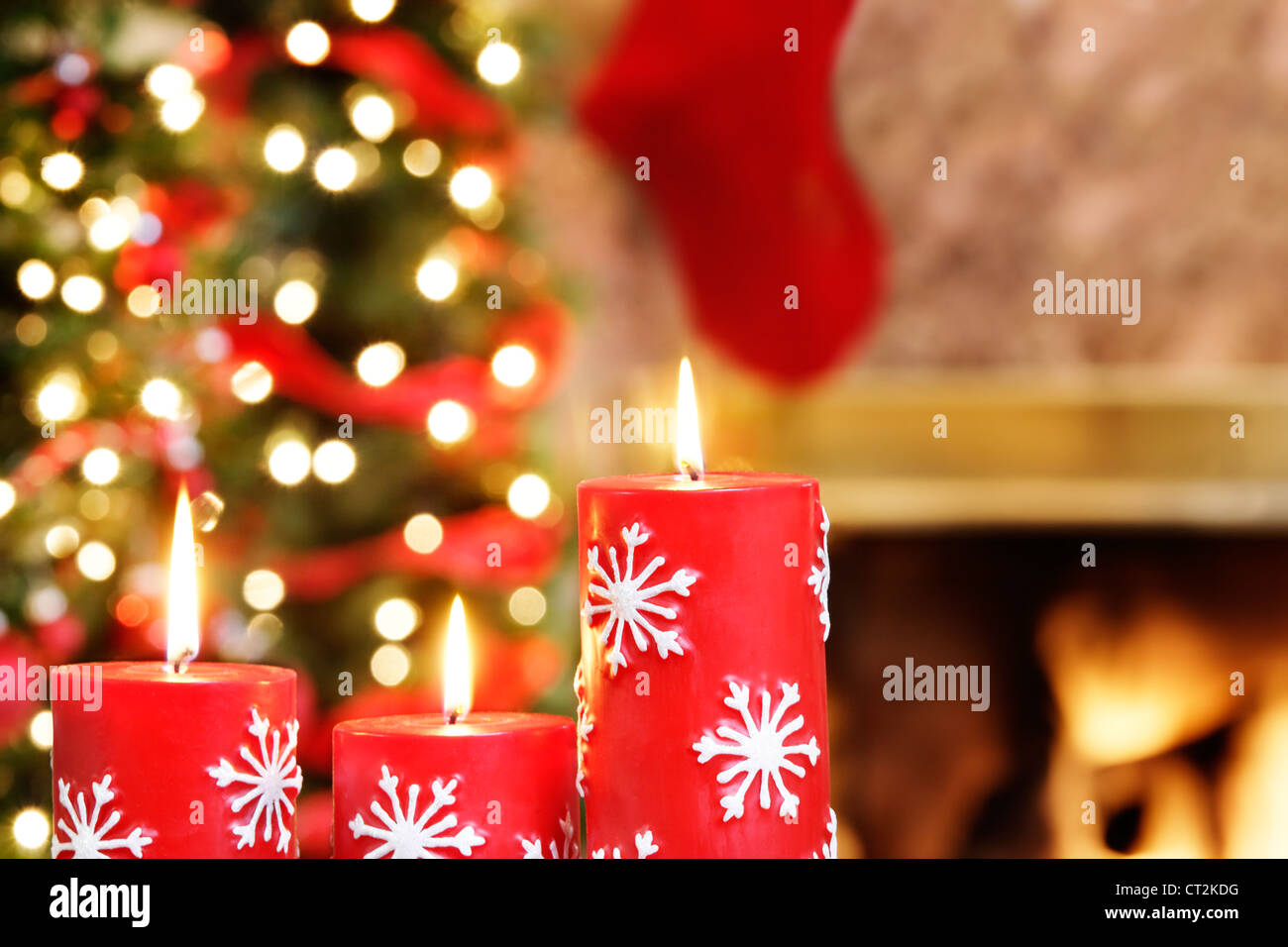 Christmas candles by the Christmas trees and fire Stock Image