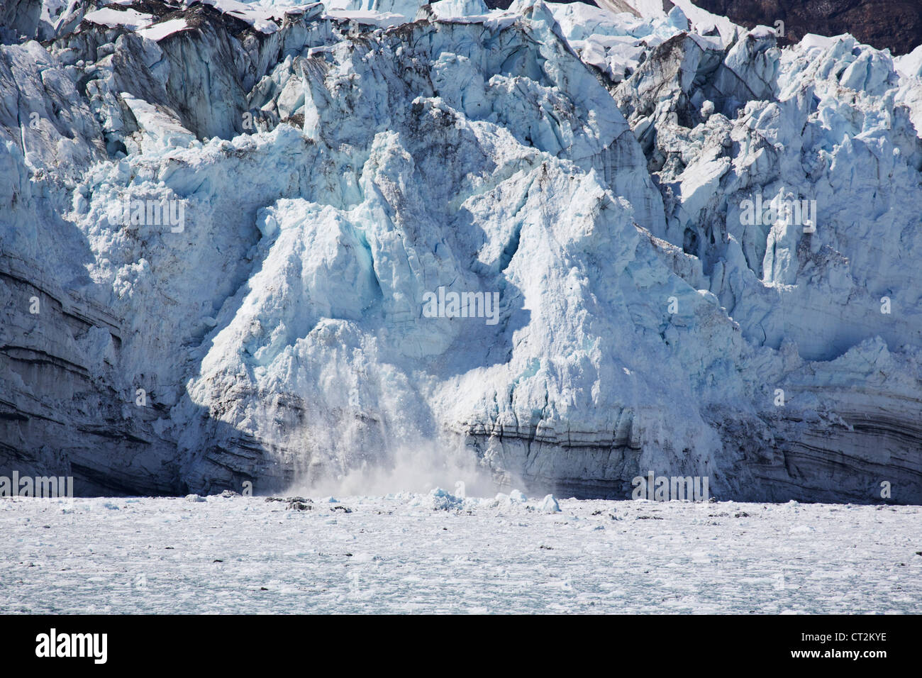 Iceberg calving from Marjerie Glacier. Glacier Bay National Park