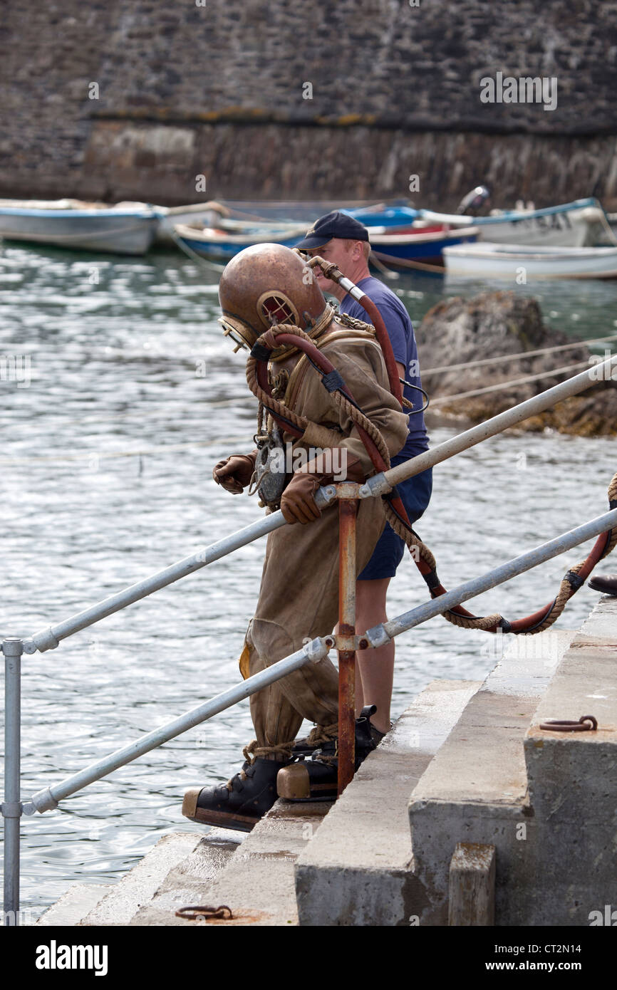 Deep Sea Diver in antiquated equipment in Mevagissey Stock Photo