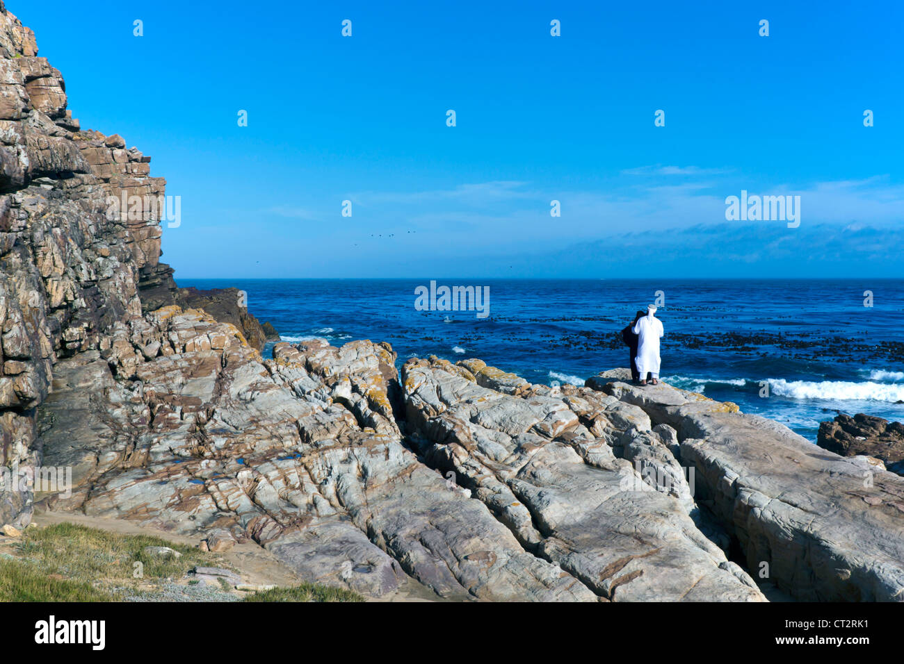 Middle Eastern tourists in traditional dress at the Cape of Good Hope, South Africa Stock Photo