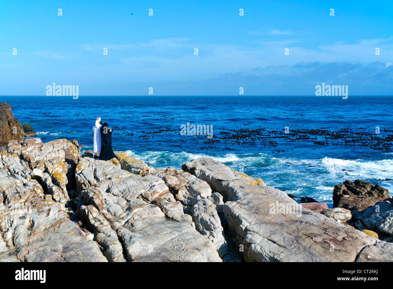 Middle Eastern tourists in traditional dress at the Cape of Good Hope, South Africa Stock Photo