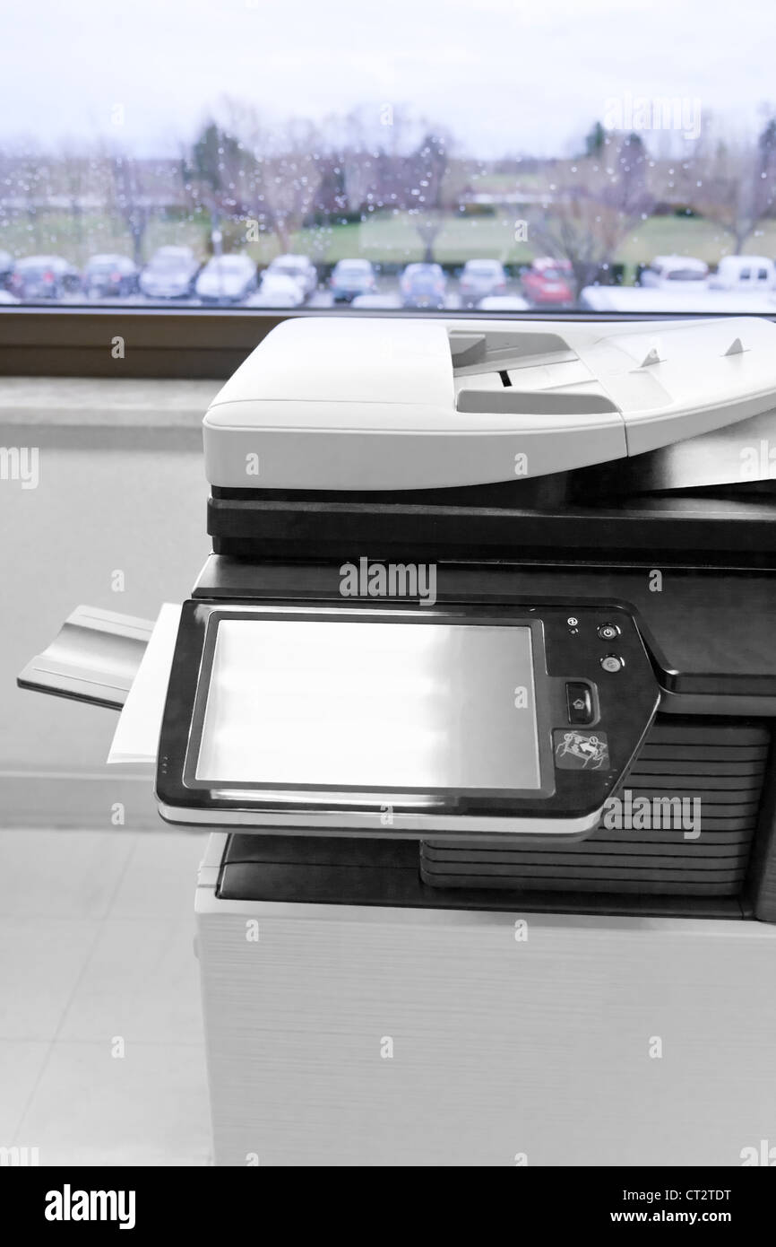 big grey copier in grey office and color life beyond window Stock Photo ...