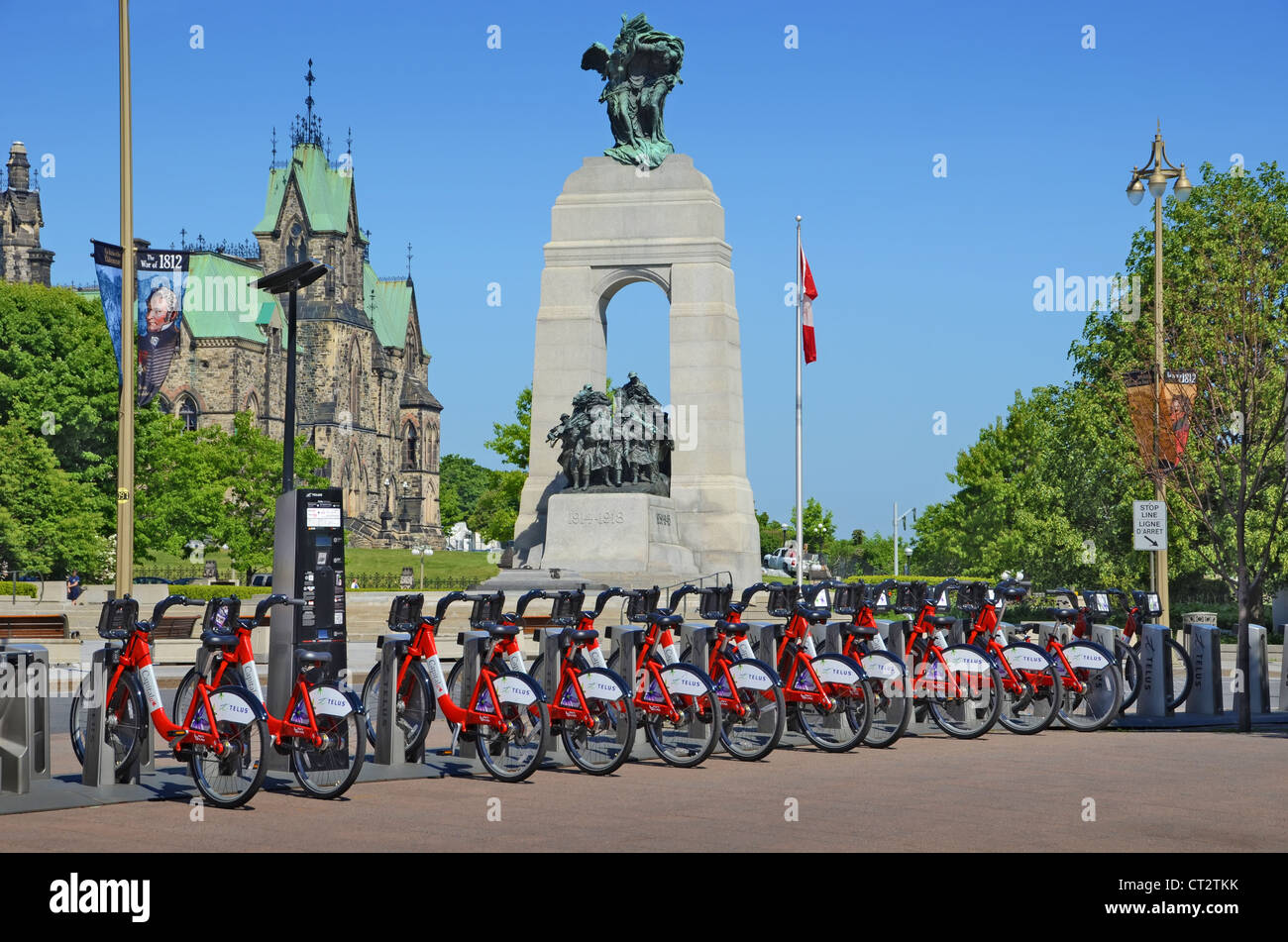 Bicycles for hire at Ottawa, Ontario, Canada. In the background is the Canadian National War Memorial. Stock Photo