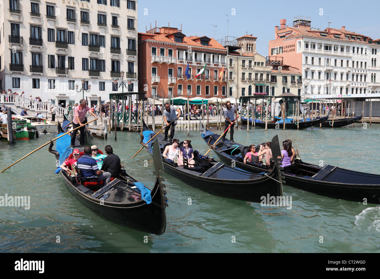 People riding in Gondolas at San Marco on the Grand Canal in Venice. Italy Stock Photo
