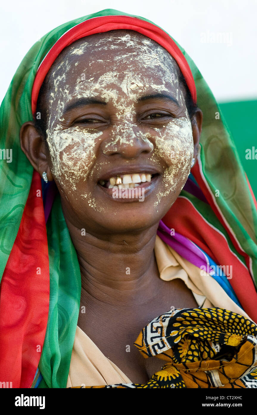 Beautiful malagasy woman in the Menabe region of Madagascar. The yellow  face paint is used as protection from the sun Stock Photo - Alamy